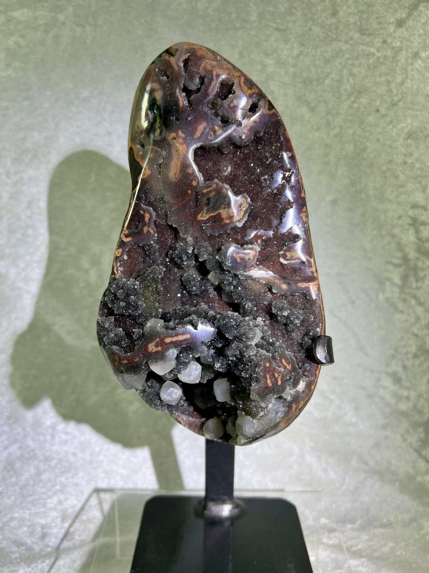 Amethyst And Calcite Geode Specimen. World Class Uruguayan Specimen. Very Rare Black, Red, And Orange Colors. Custom Made Steel Stand