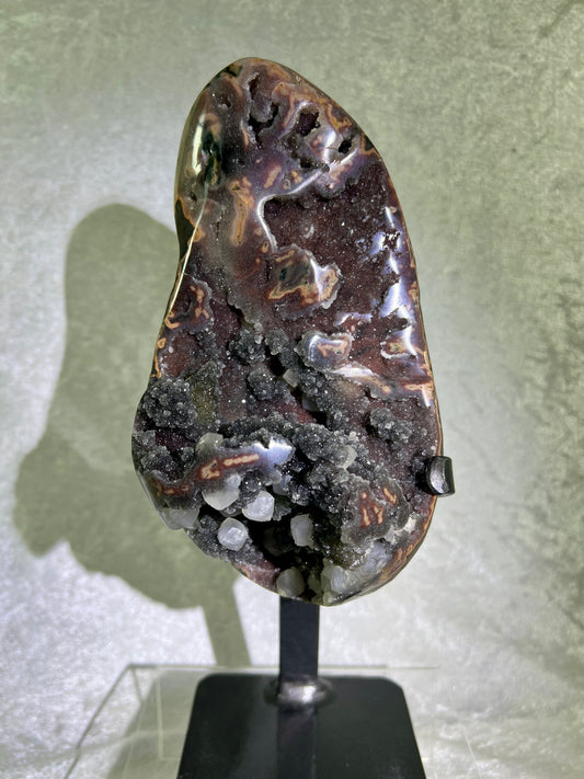 Amethyst And Calcite Geode Specimen. World Class Uruguayan Specimen. Very Rare Black, Red, And Orange Colors. Custom Made Steel Stand