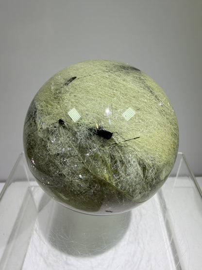 Black Tourmaline And Rabbit Hair Quartz Sphere. 70mm. Stunning Rabbit Hair Rutile With Black Tourmaline Inclusions. Very Rare Display Sphere.