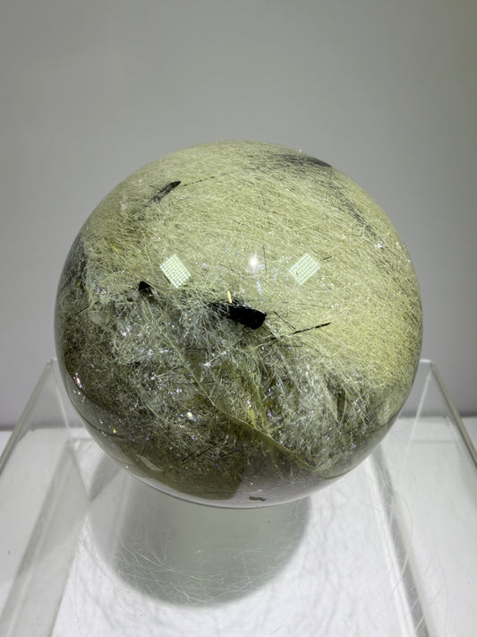 Black Tourmaline And Rabbit Hair Quartz Sphere. 70mm. Stunning Rabbit Hair Rutile With Black Tourmaline Inclusions. Very Rare Display Sphere.