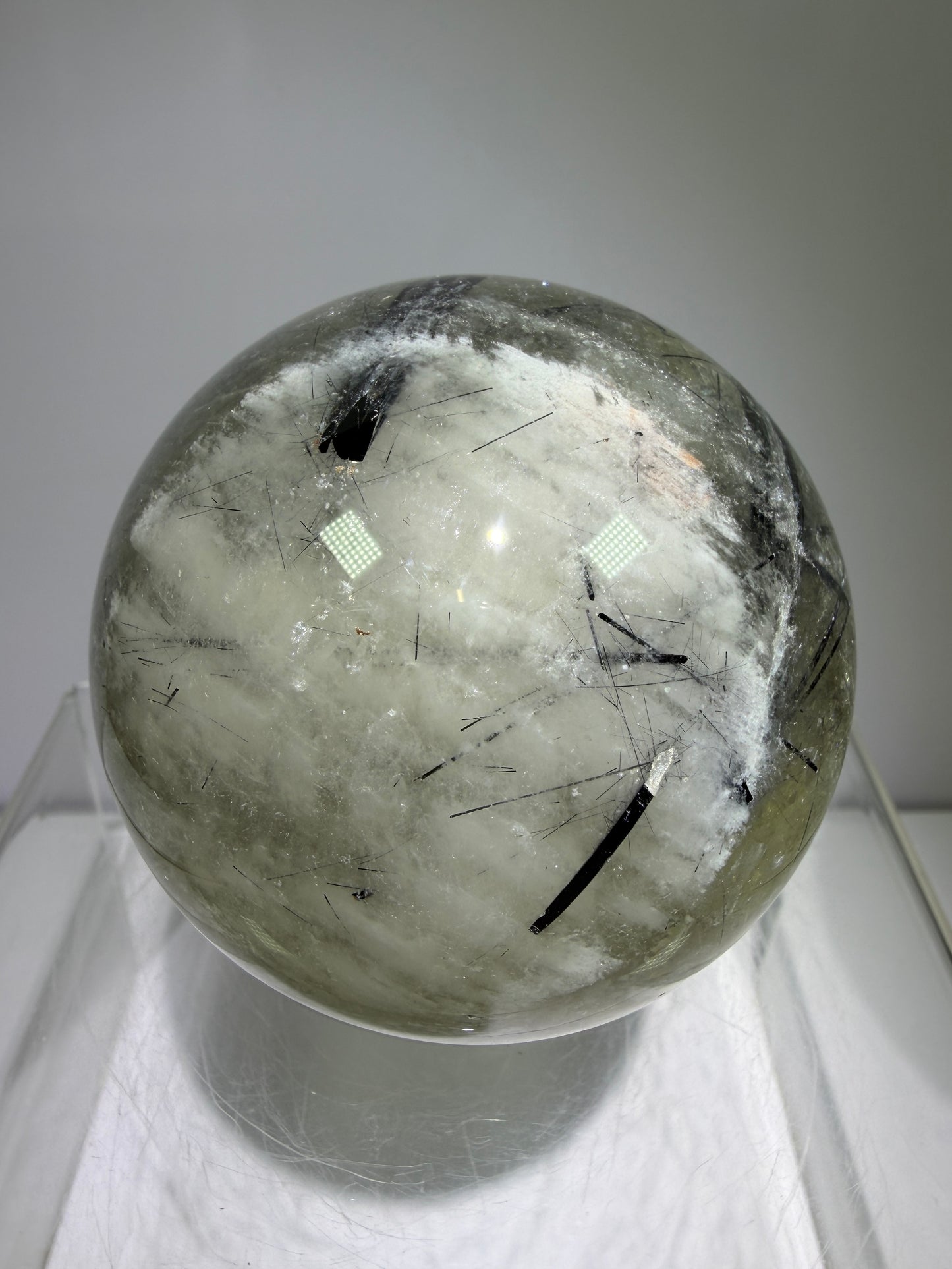 Black Tourmaline And Rabbit Hair Quartz Sphere. 70mm. Stunning Rabbit Hair Rutile With Black Tourmaline Inclusions. Very Rare Display Sphere.