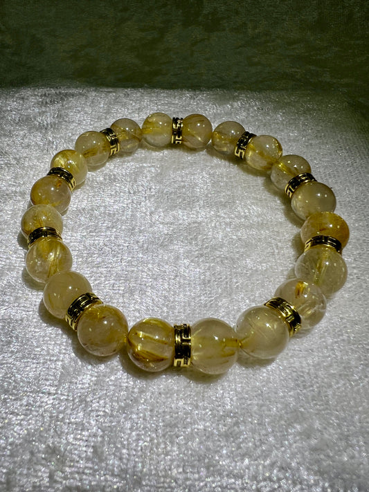 Rutile Quartz Crystal Bead Bracelet. Beautiful Rutilated Quartz Bracelet. 9.5mm. Amazing Golden Spacers.