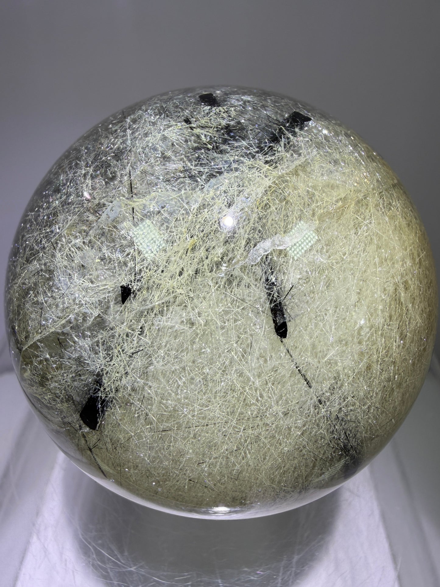 Black Tourmaline And Rabbit Hair Quartz Sphere. 70mm. Stunning Rabbit Hair Rutile With Black Tourmaline Inclusions. Very Rare Display Sphere.