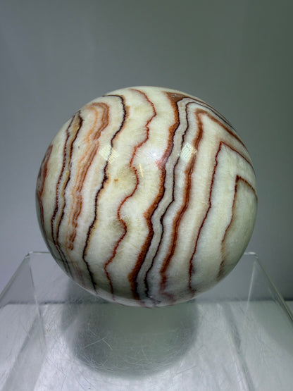 Pork Stone Crystal Sphere. 77mm. Red Banded Calcite Display Sphere. High Quality UV Reactive Crystal