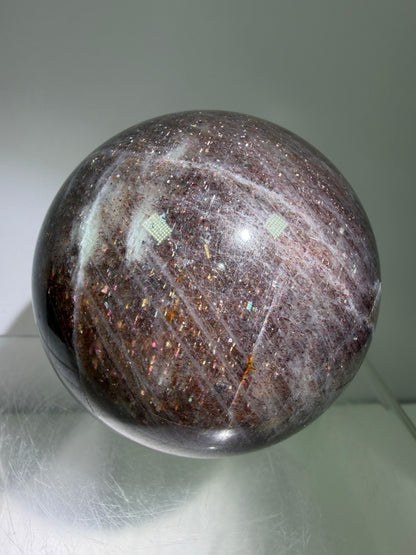 Bloodshot Iolite Sphere. 64mm. Stunning Galaxy Iolite Sunstone Display Sphere. Amazing And Colorful Flash!