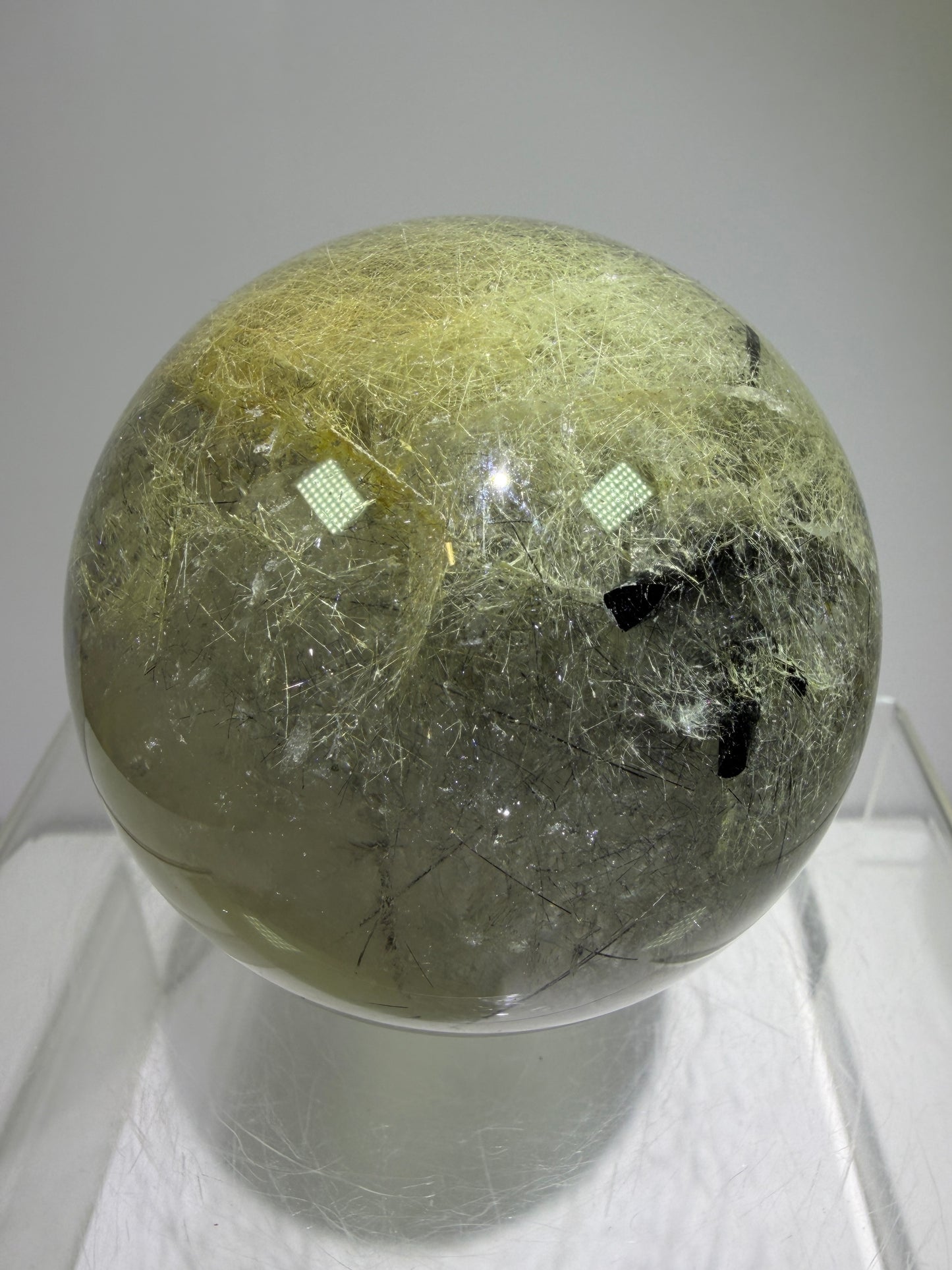 Black Tourmaline And Rabbit Hair Quartz Sphere. 70mm. Stunning Rabbit Hair Rutile With Black Tourmaline Inclusions. Very Rare Display Sphere.