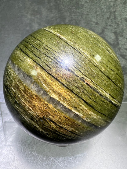 Vesuvianite Crystal Sphere. 71mm. High Quality Idocrase Display Sphere. Incredible Banding And Patterns.
