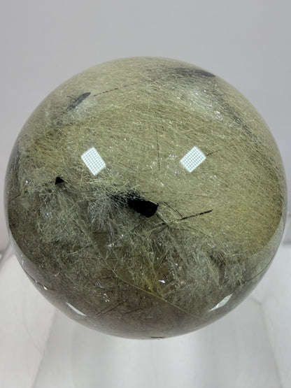 Black Tourmaline And Rabbit Hair Quartz Sphere. 70mm. Stunning Rabbit Hair Rutile With Black Tourmaline Inclusions. Very Rare Display Sphere.