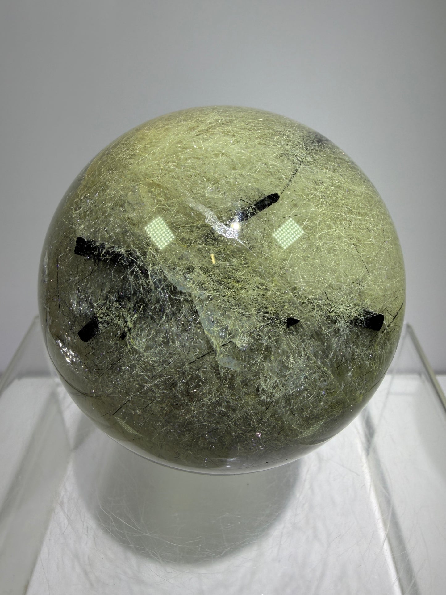 Black Tourmaline And Rabbit Hair Quartz Sphere. 70mm. Stunning Rabbit Hair Rutile With Black Tourmaline Inclusions. Very Rare Display Sphere.