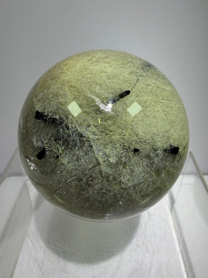 Black Tourmaline And Rabbit Hair Quartz Sphere. 70mm. Stunning Rabbit Hair Rutile With Black Tourmaline Inclusions. Very Rare Display Sphere.