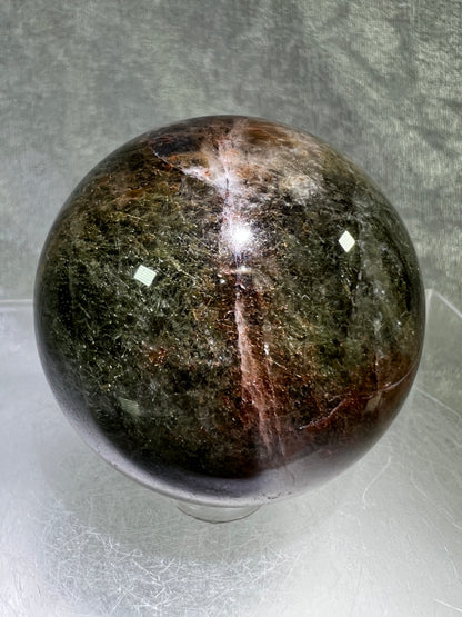 Tourmalinated Quartz Sphere. 52mm. Gorgeous Red And Green Tourmaline Inclusions. Rare And Unique Display Sphere.
