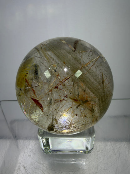 Rutile And Tourmaline Quartz Sphere. 43mm. Incredible Rainbows, With Phantoms And Spots Of Lodolite. Very Rare Display Sphere
