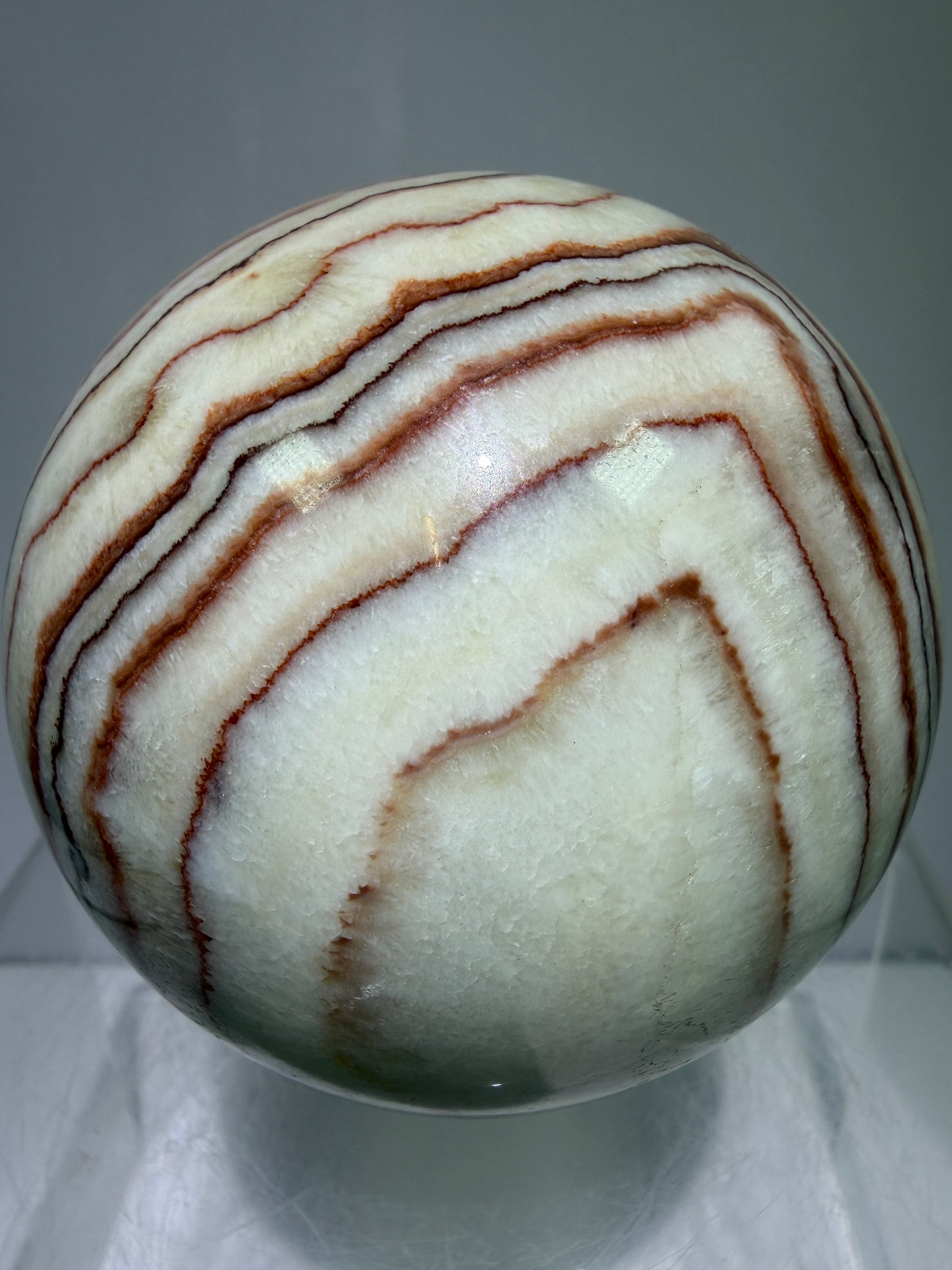 Pork Stone Crystal Sphere. 77mm. Red Banded Calcite Display Sphere. High Quality UV Reactive Crystal
