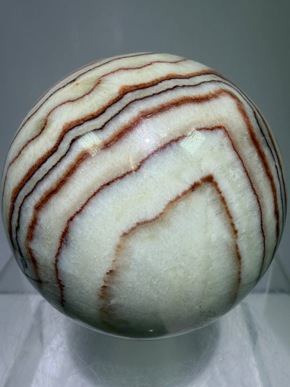 Pork Stone Crystal Sphere. 77mm. Red Banded Calcite Display Sphere. High Quality UV Reactive Crystal