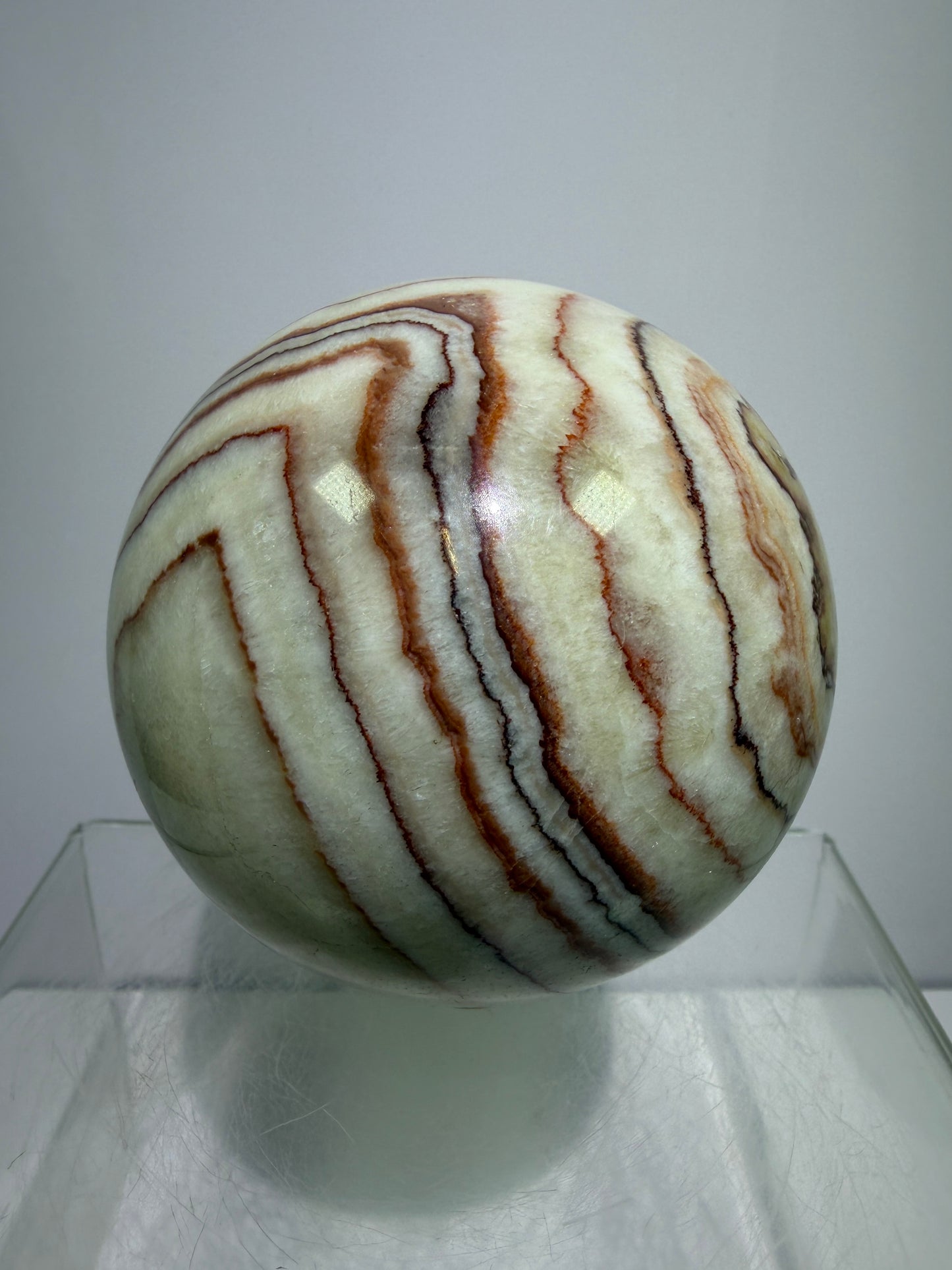 Pork Stone Crystal Sphere. 77mm. Red Banded Calcite Display Sphere. High Quality UV Reactive Crystal