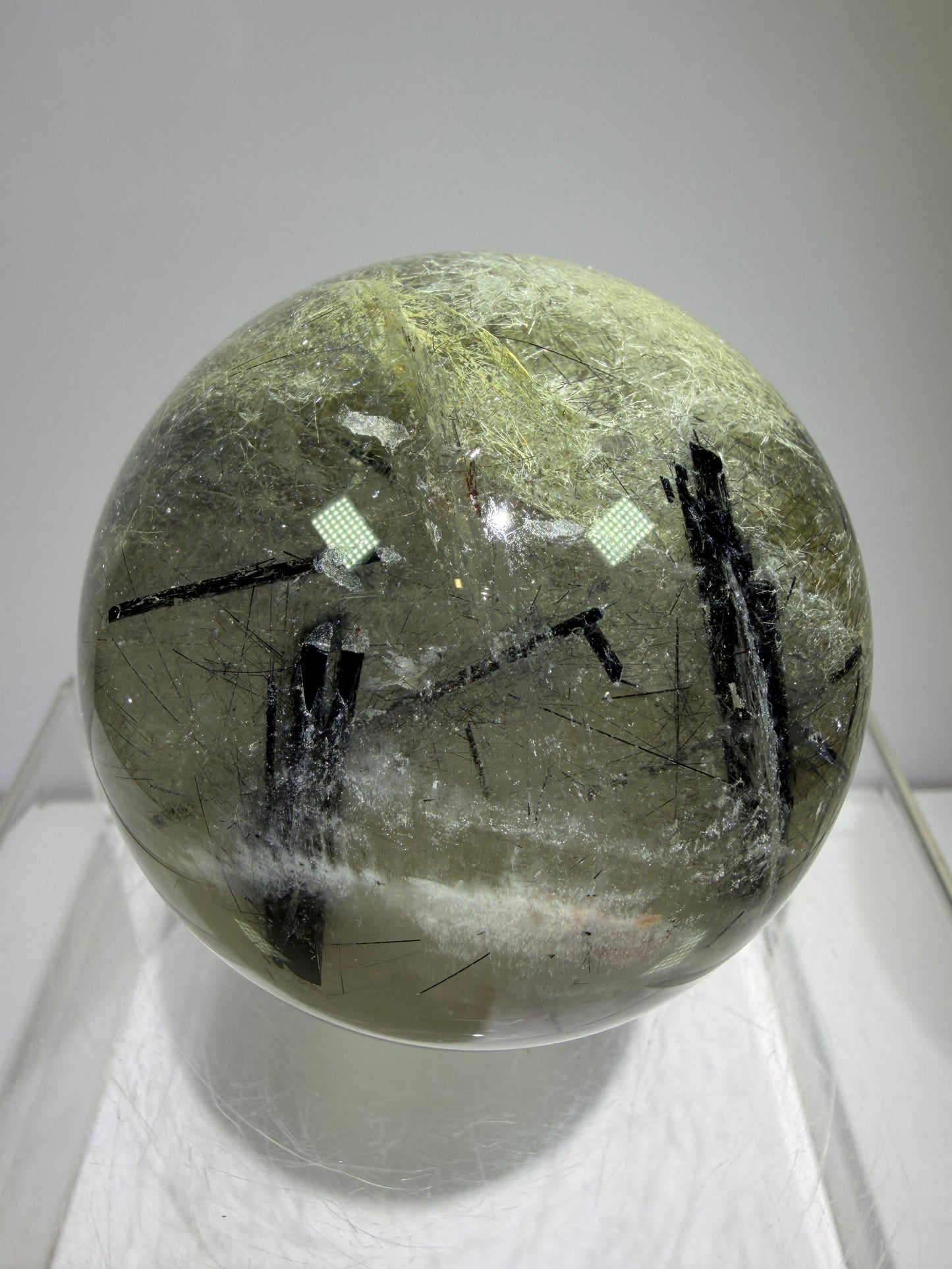 Black Tourmaline And Rabbit Hair Quartz Sphere. 70mm. Stunning Rabbit Hair Rutile With Black Tourmaline Inclusions. Very Rare Display Sphere.