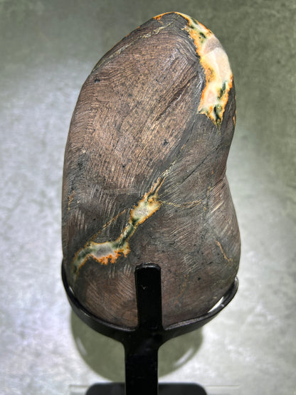 Amethyst And Calcite Geode Specimen. World Class Uruguayan Specimen. Very Rare Black, Red, And Orange Colors. Custom Made Steel Stand