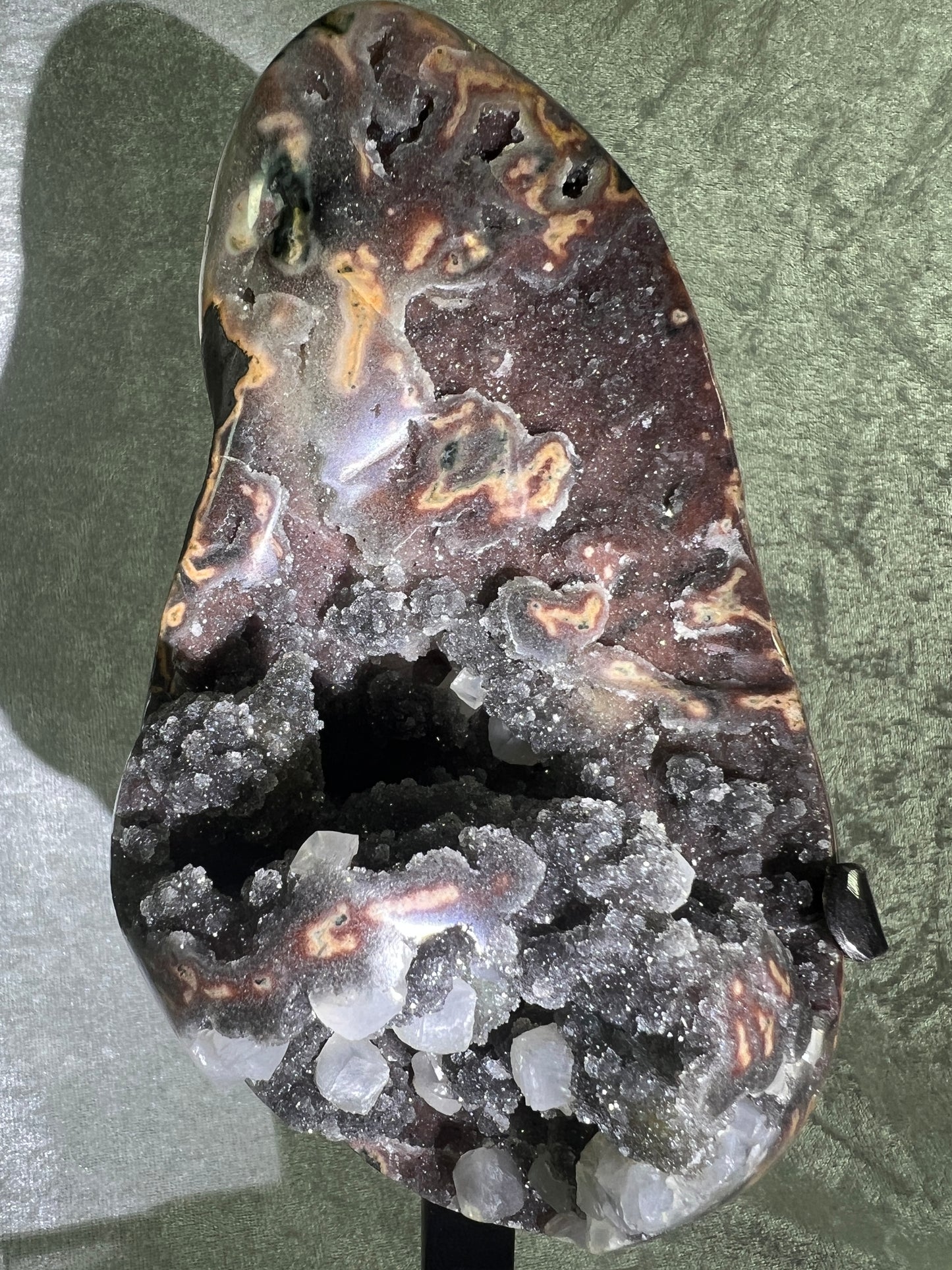 Amethyst And Calcite Geode Specimen. World Class Uruguayan Specimen. Very Rare Black, Red, And Orange Colors. Custom Made Steel Stand