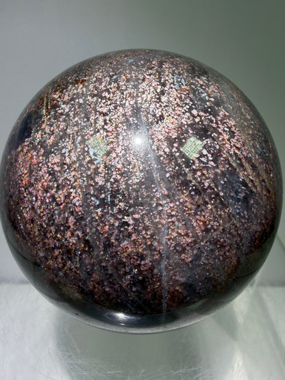 Bloodshot Iolite Sphere. 64mm. Stunning Galaxy Iolite Sunstone Display Sphere. Amazing And Colorful Flash!