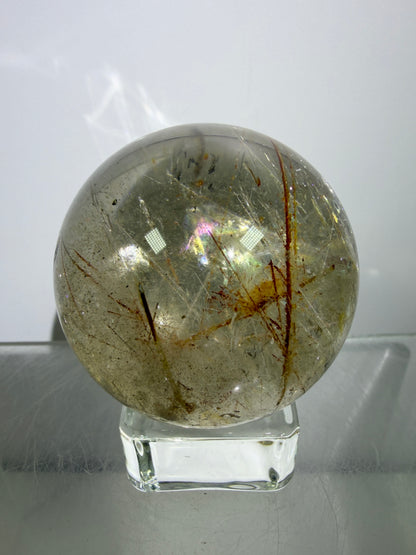 Rutile And Tourmaline Quartz Sphere. 43mm. Incredible Rainbows, With Phantoms And Spots Of Lodolite. Very Rare Display Sphere