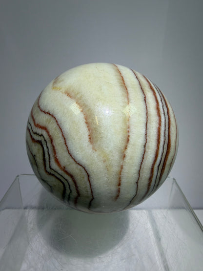 Pork Stone Crystal Sphere. 77mm. Red Banded Calcite Display Sphere. High Quality UV Reactive Crystal