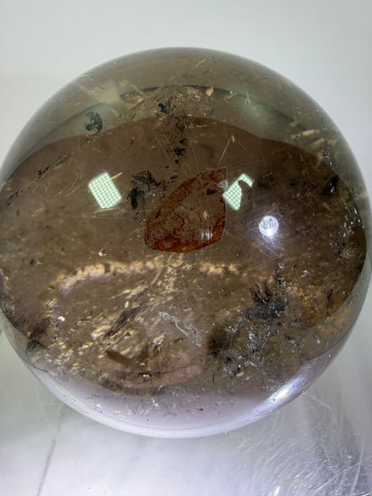 Rutile Quartz Sphere. 70mm. Large Smoky Quartz With Rare Golden Rutile Inclusions. Nice Quality Display