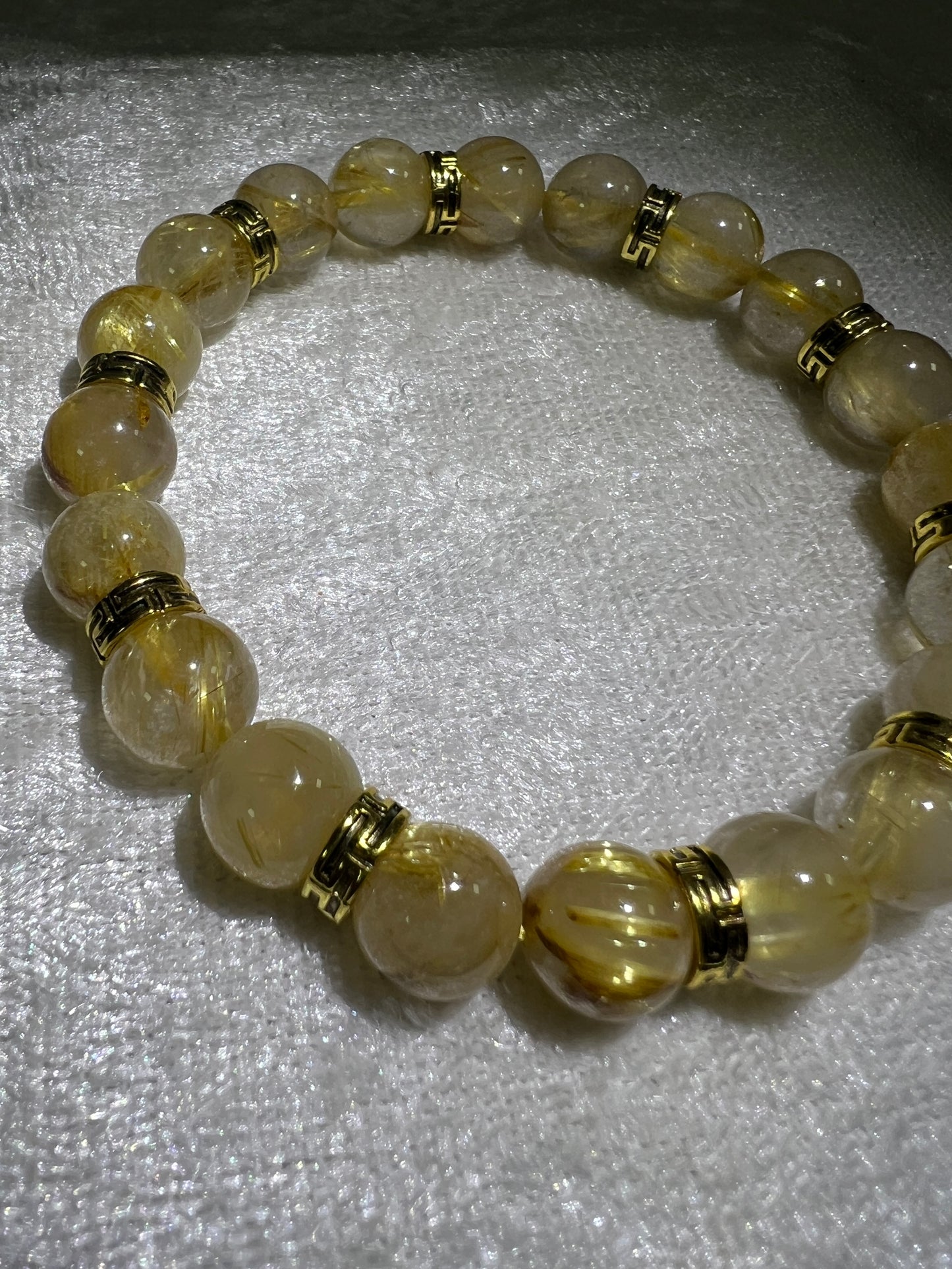 Rutile Quartz Crystal Bead Bracelet. Beautiful Rutilated Quartz Bracelet. 9.5mm. Amazing Golden Spacers.