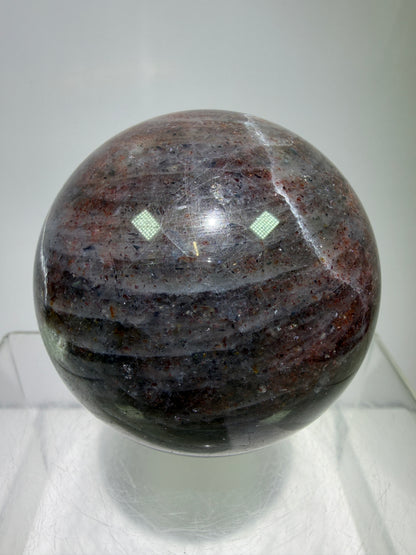 Bloodshot Iolite Sphere. 64mm. Stunning Galaxy Iolite Sunstone Display Sphere. Amazing And Colorful Flash!