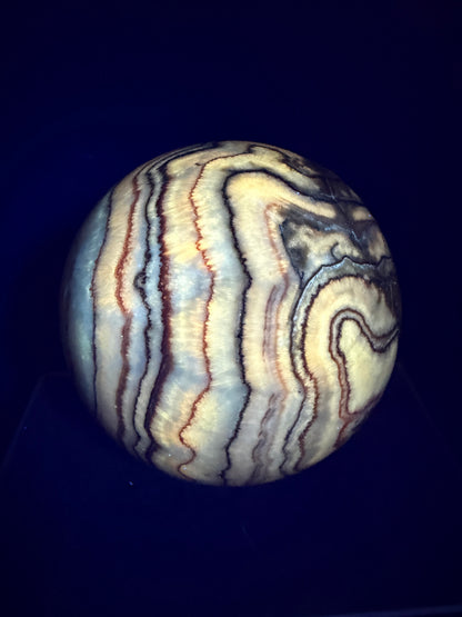 Pork Stone Crystal Sphere. 77mm. Red Banded Calcite Display Sphere. High Quality UV Reactive Crystal