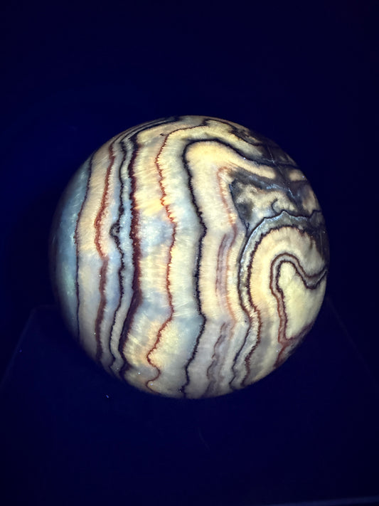 Pork Stone Crystal Sphere. 77mm. Red Banded Calcite Display Sphere. High Quality UV Reactive Crystal