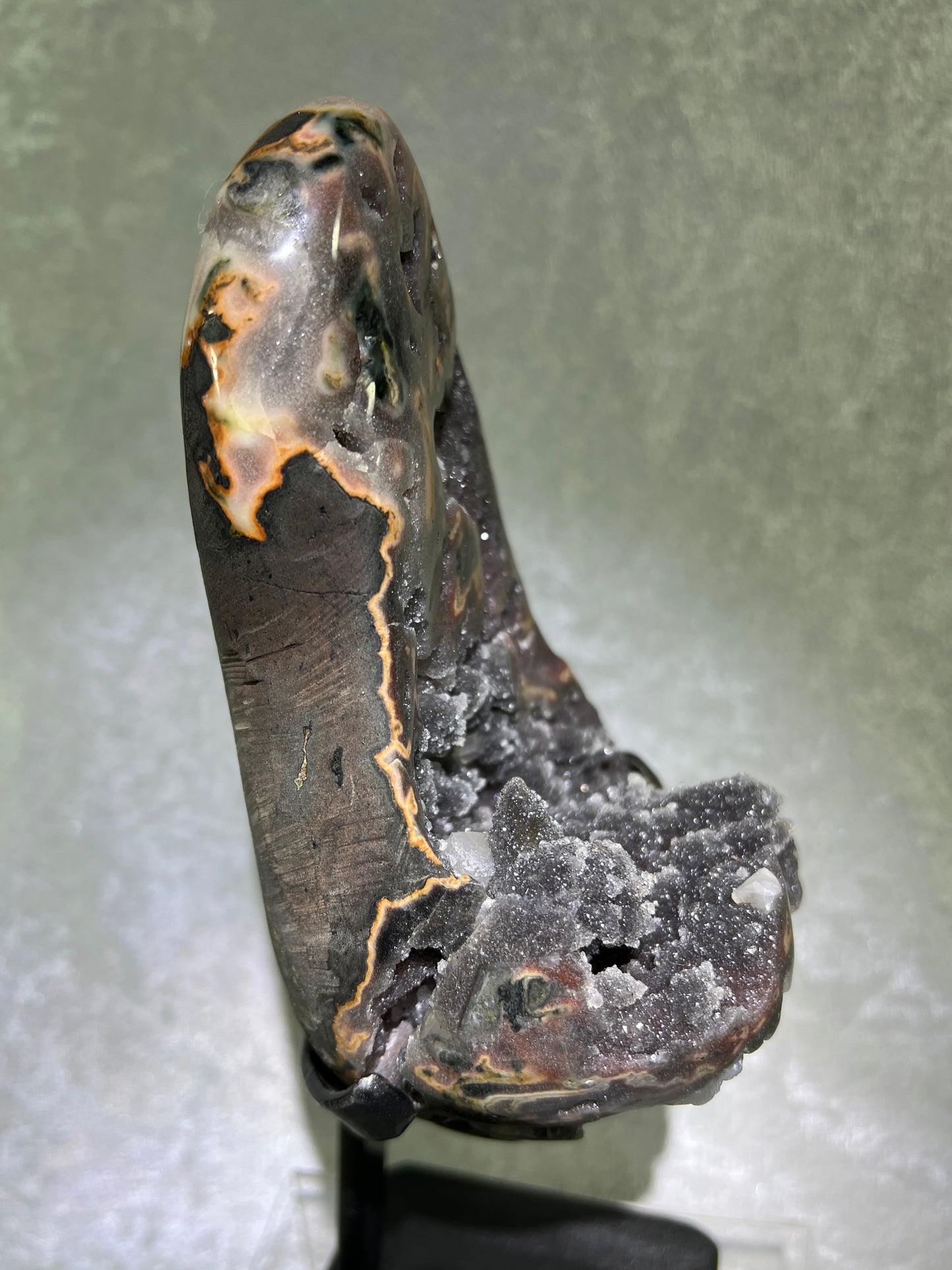 Amethyst And Calcite Geode Specimen. World Class Uruguayan Specimen. Very Rare Black, Red, And Orange Colors. Custom Made Steel Stand