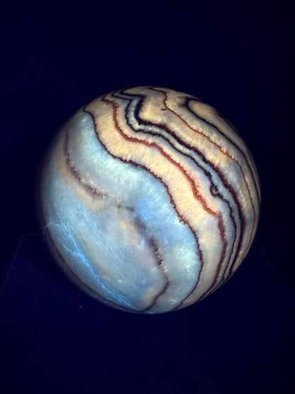 Pork Stone Crystal Sphere. 77mm. Red Banded Calcite Display Sphere. High Quality UV Reactive Crystal