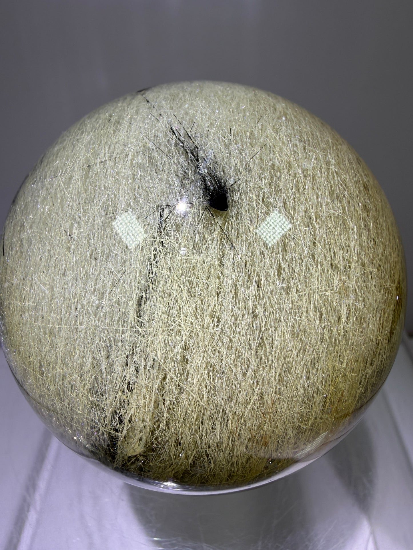 Black Tourmaline And Rabbit Hair Quartz Sphere. 70mm. Stunning Rabbit Hair Rutile With Black Tourmaline Inclusions. Very Rare Display Sphere.