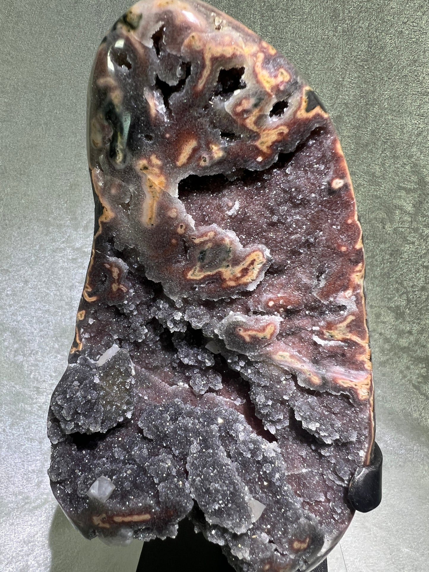Amethyst And Calcite Geode Specimen. World Class Uruguayan Specimen. Very Rare Black, Red, And Orange Colors. Custom Made Steel Stand