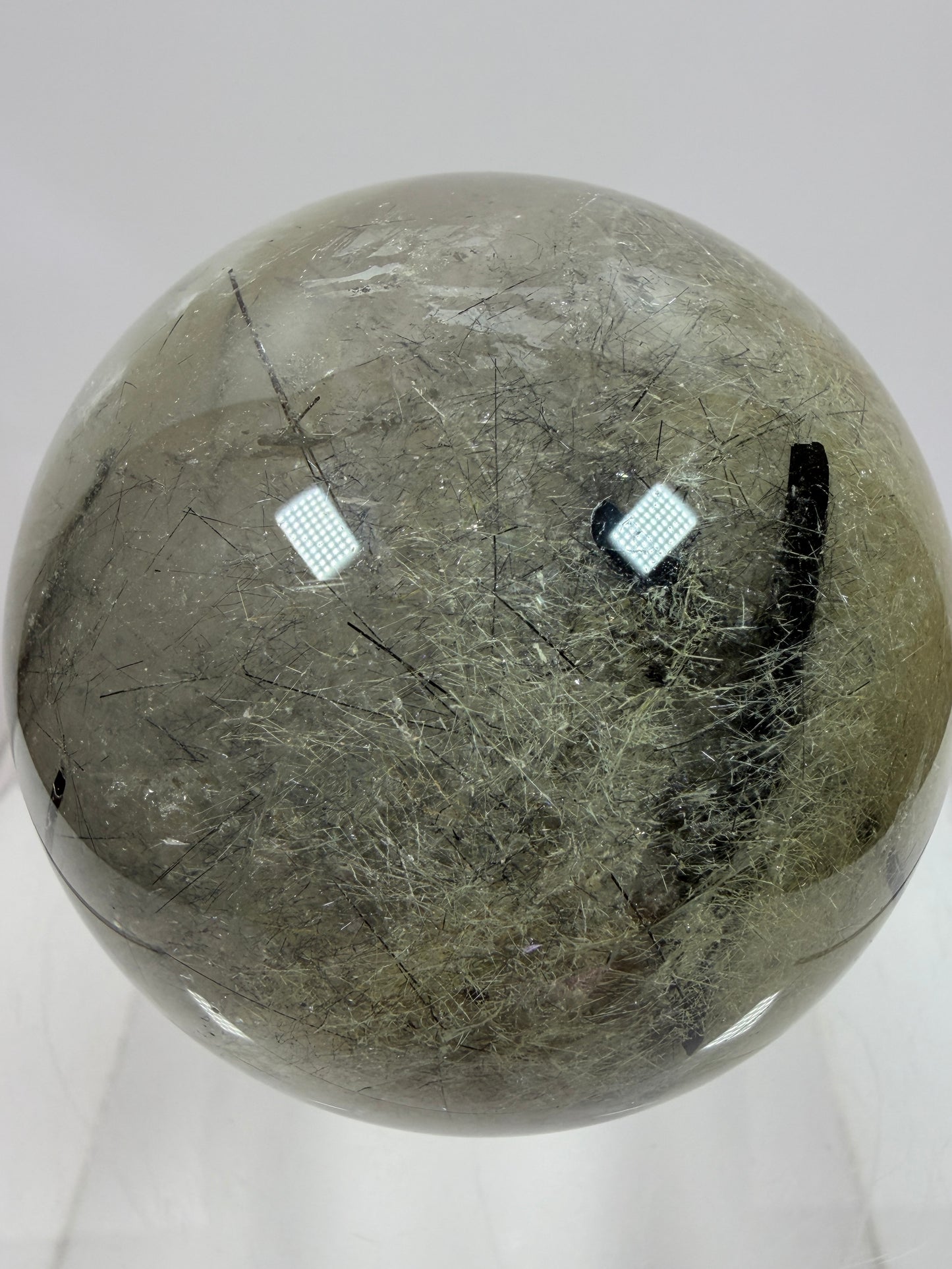 Black Tourmaline And Rabbit Hair Quartz Sphere. 70mm. Stunning Rabbit Hair Rutile With Black Tourmaline Inclusions. Very Rare Display Sphere.