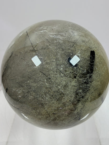 Black Tourmaline And Rabbit Hair Quartz Sphere. 70mm. Stunning Rabbit Hair Rutile With Black Tourmaline Inclusions. Very Rare Display Sphere.