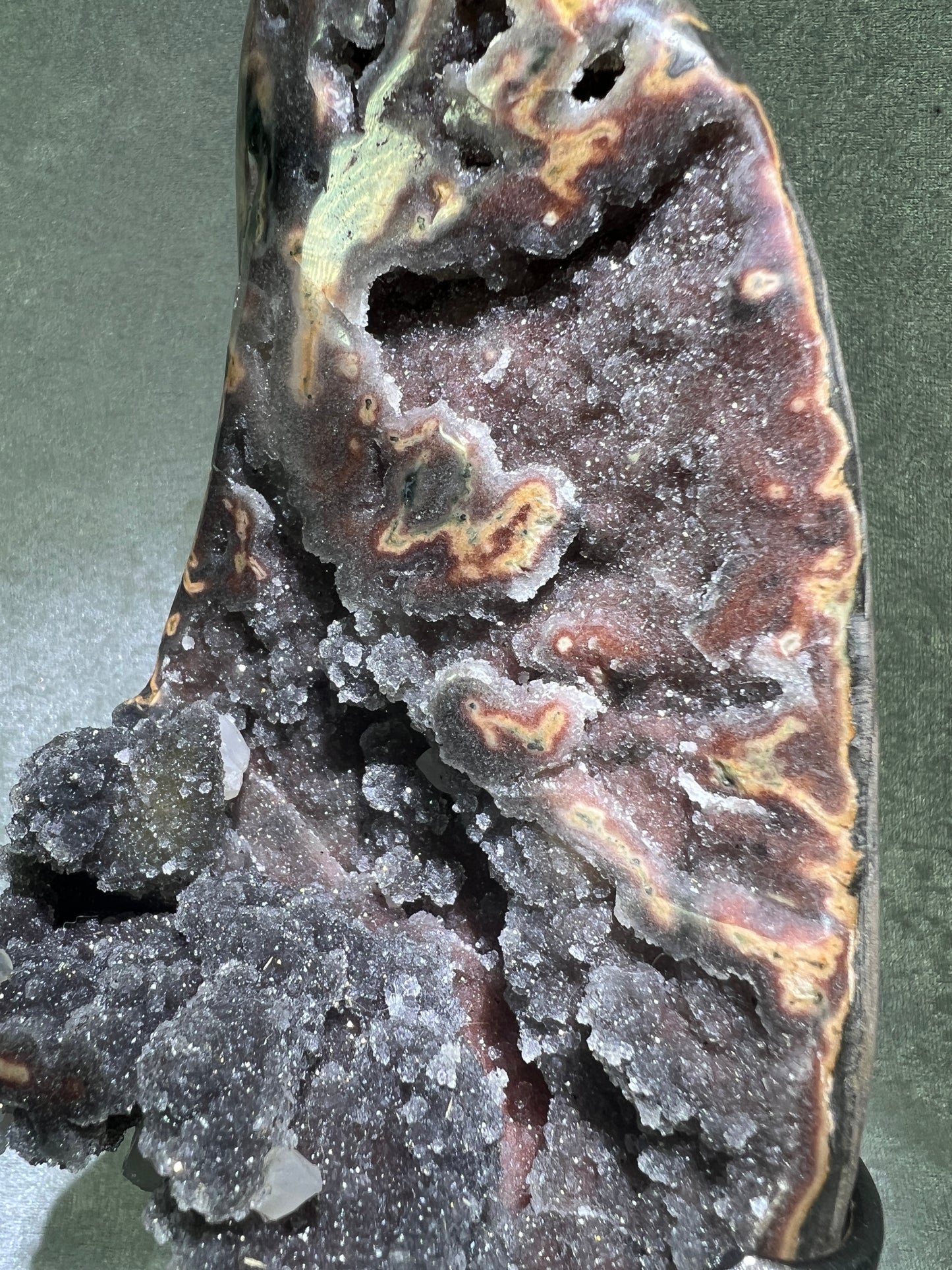 Amethyst And Calcite Geode Specimen. World Class Uruguayan Specimen. Very Rare Black, Red, And Orange Colors. Custom Made Steel Stand