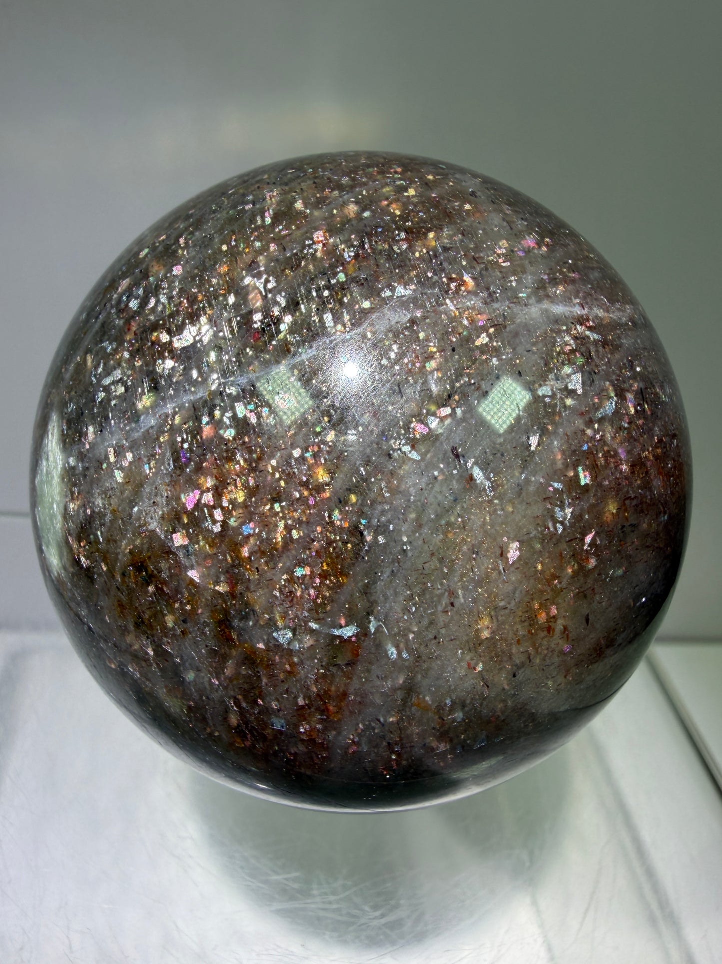 Bloodshot Iolite Sphere. 64mm. Stunning Galaxy Iolite Sunstone Display Sphere. Amazing And Colorful Flash!