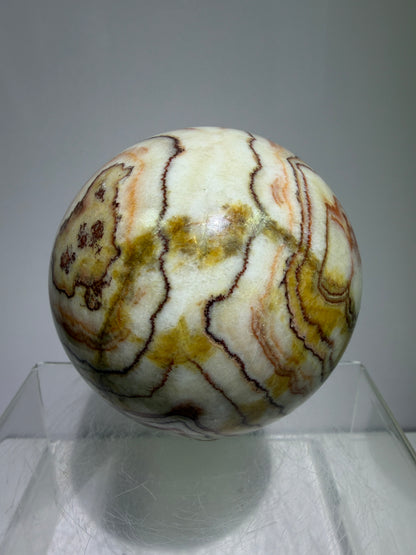 Pork Stone Crystal Sphere. 77mm. Red Banded Calcite Display Sphere. High Quality UV Reactive Crystal