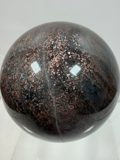 Bloodshot Iolite Sphere. 64mm. Stunning Galaxy Iolite Sunstone Display Sphere. Amazing And Colorful Flash!