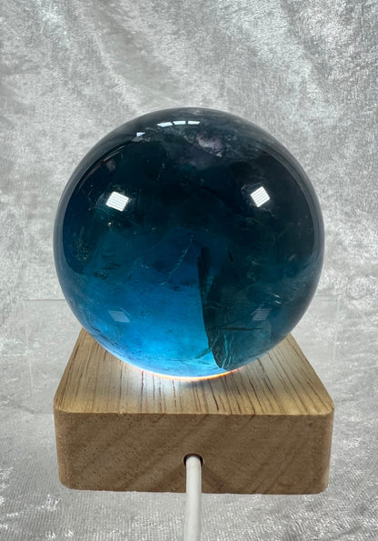 Gorgeous Blue Fluorite Sphere. 65mm. Beautiful Rainbows! White Light Display Stand Is Included. Very Nice Quality Sphere.