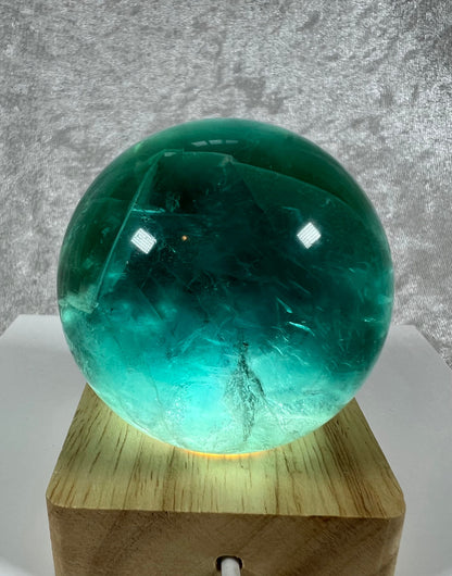 Incredible Emerald Green Fluorite Sphere. 63mm. Stunning And Clear Green Color. Includes White Light Stand!