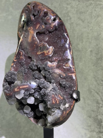 Amethyst And Calcite Geode Specimen. World Class Uruguayan Specimen. Very Rare Black, Red, And Orange Colors. Custom Made Steel Stand