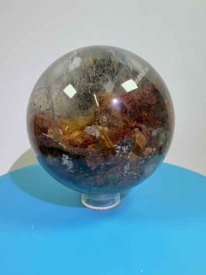 Garden Quartz Lodolite Sphere. 57mm. Orange And Red Colorful Landscape. High Quality With Rare Colors!