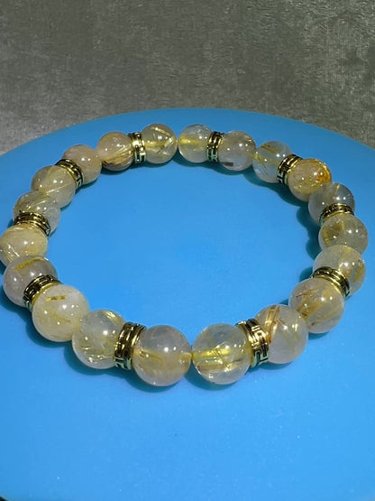 Rutile Quartz Crystal Bead Bracelet. Beautiful Rutilated Quartz Bracelet. 9.5mm. Amazing Golden Spacers.