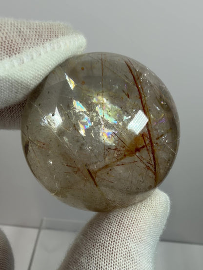 Rutile And Tourmaline Quartz Sphere. 43mm. Incredible Rainbows, With Phantoms And Spots Of Lodolite. Very Rare Display Sphere